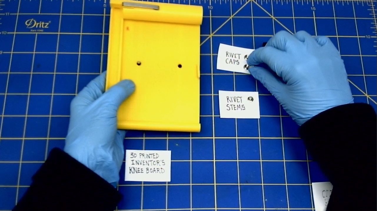 Hold the rivet in place