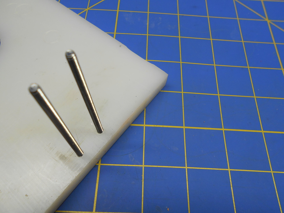 The screws are placed in the base of the Jig